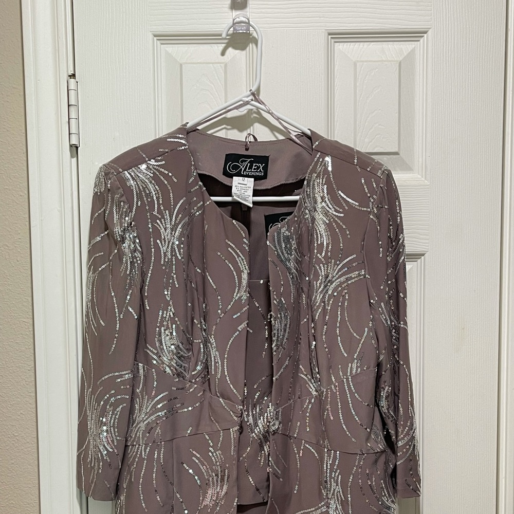 Alex - size 12.  There is a spot on skirt.